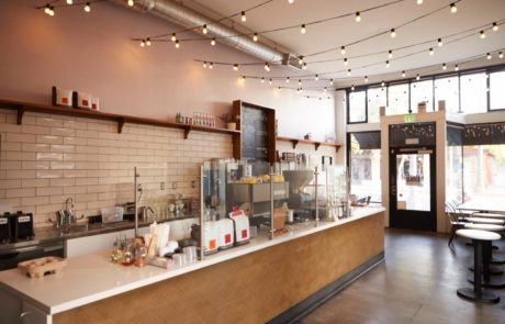 A Custom Herringbone Elevation Panel made of Veneer on a Wall in a Coffee Shop