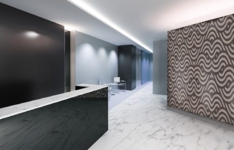 A Custom Unfinished Modern Swirl Elevation Panel made of Veneer on a Wall in a Office Space